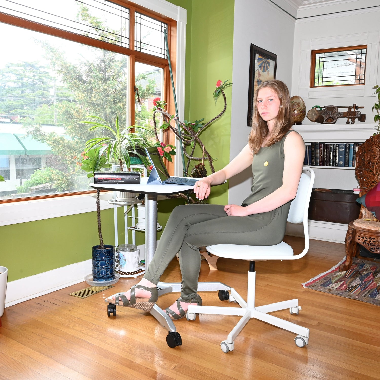 Woman wearing olive color jumpsuit